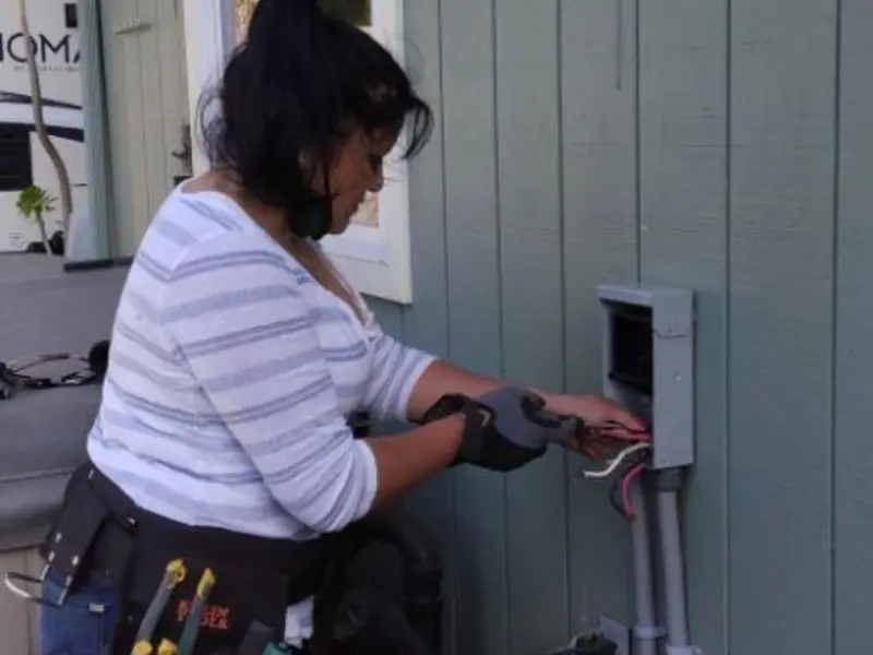 Licensed electrician wiring an exterior subpanel in Adamsville