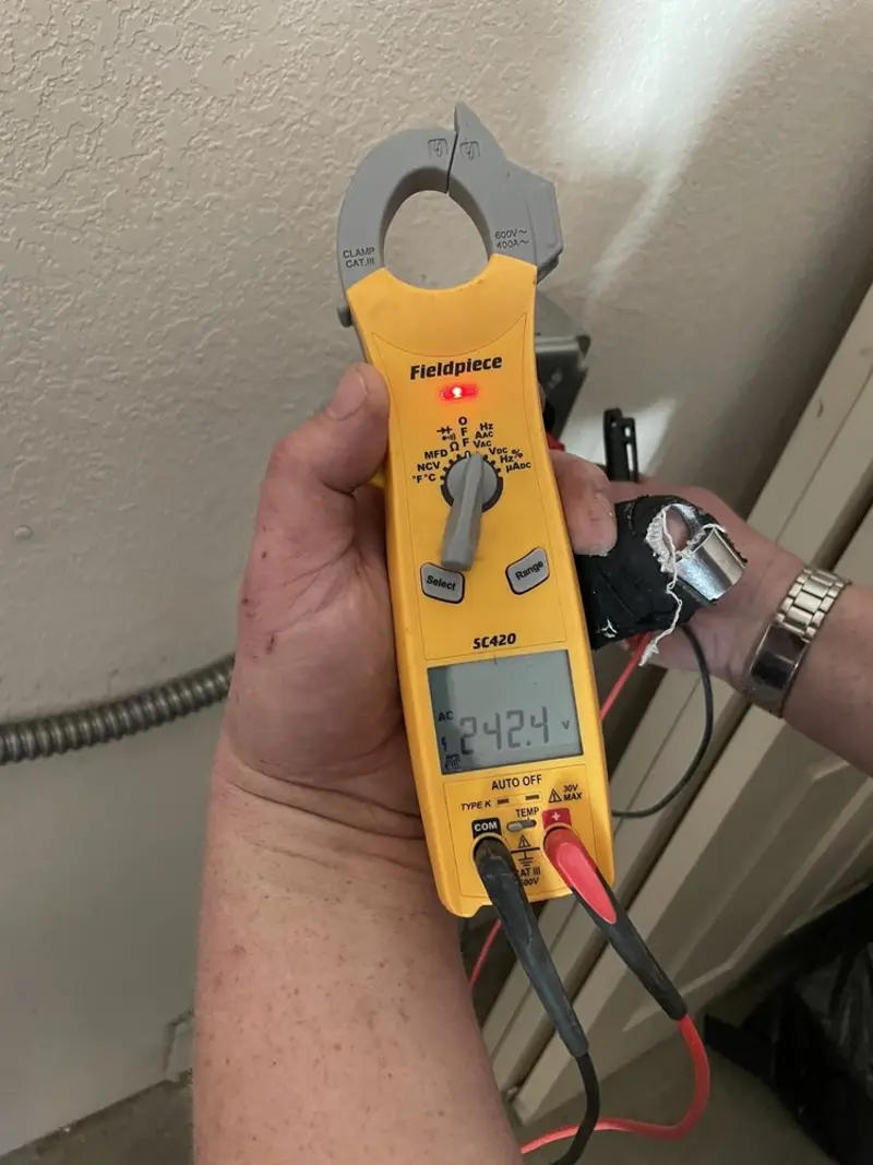 Voltage testing with clamp meter during Whole House Surge Protector in Adamsville